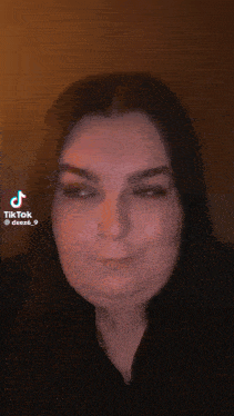 a woman is making a funny face in a tiktok video