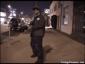 a man standing on a sidewalk with a freegifmaker.me watermark on the bottom right