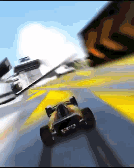 a blurred image of a race car with a license plate that says gm