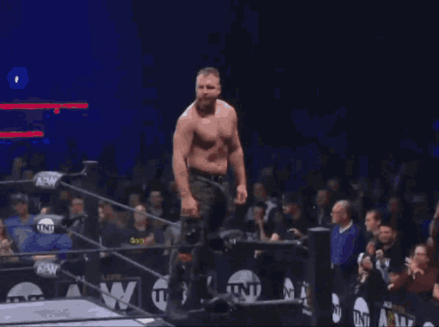 a man in a wrestling ring with a shirt that says golden on it