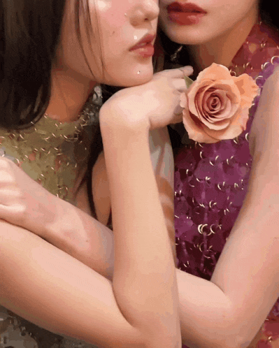 a woman in a purple dress is holding a rose