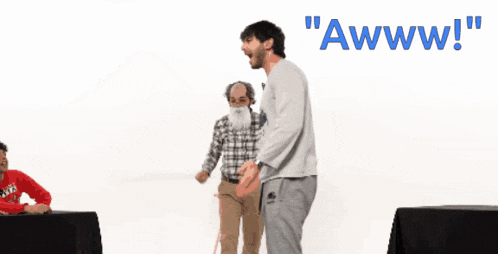 a man with a beard is kneeling down in front of a sign that says awww