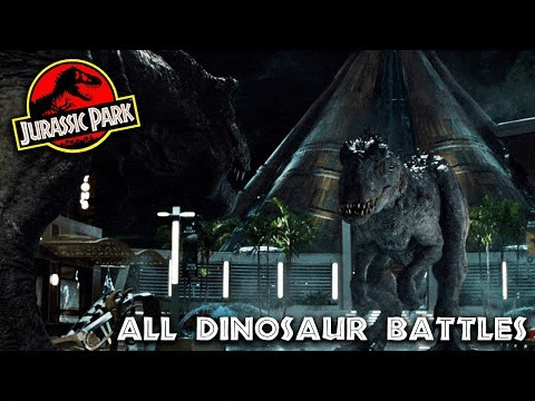 a t-rex and an indominus rex are standing next to each other in jurassic park .