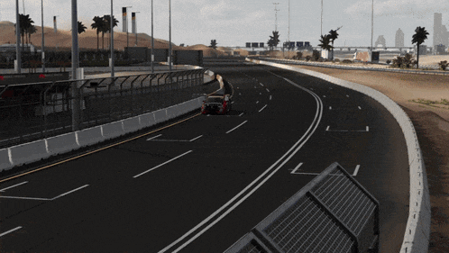 a car is driving down a highway under a dubai banner