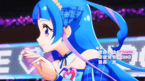 a girl with blue hair is standing in front of a sign that says ev on it