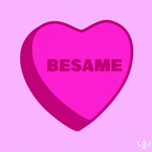 a pink heart that says besame on it on a pink background