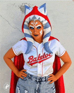 a woman wearing a white shirt that says baketo