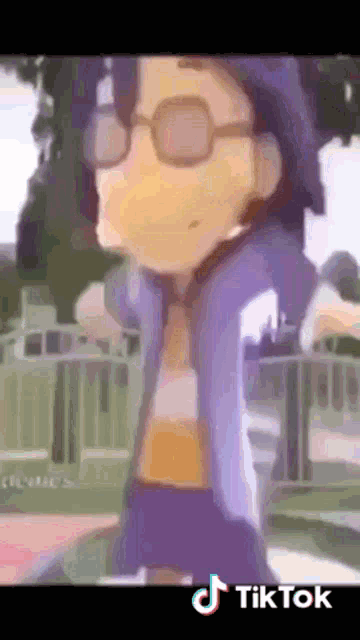 a tiktok video of a boy with glasses and a hat
