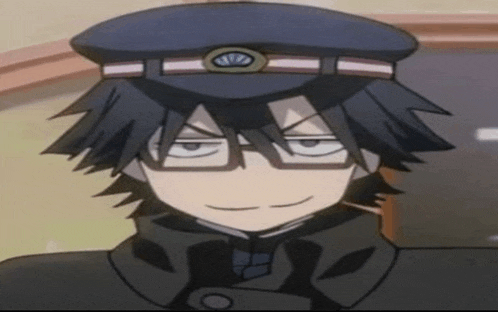 a close up of a boy wearing a hat and glasses .