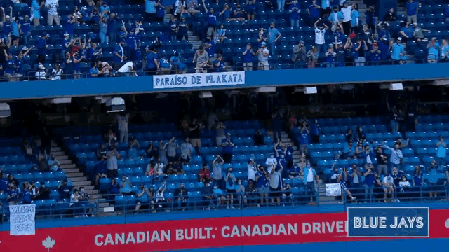 a blue jays baseball stadium with a sign that says canadian built