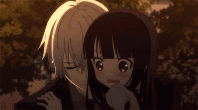 a man and a girl are hugging each other