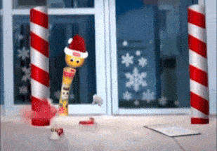 a christmas scene with candy canes and a candy cane wearing a santa hat
