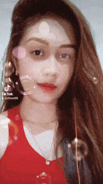 a tiktok video of a woman with bubbles around her