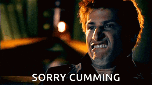 a man with red hair is making a funny face and says `` sorry cumming '' .