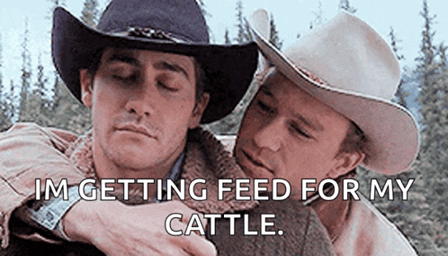 two men in cowboy hats are hugging each other and one of them is saying `` i 'm getting feed for my cattle ''