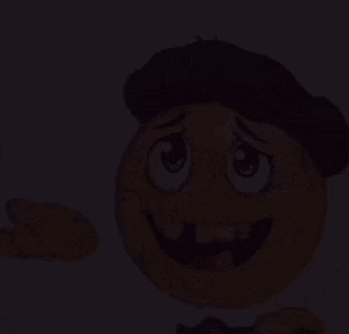 a cartoon smiley face wearing a hat and a tie .