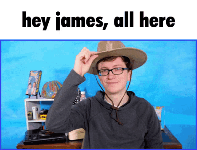 a man wearing a cowboy hat and glasses with the words hey james all here below him