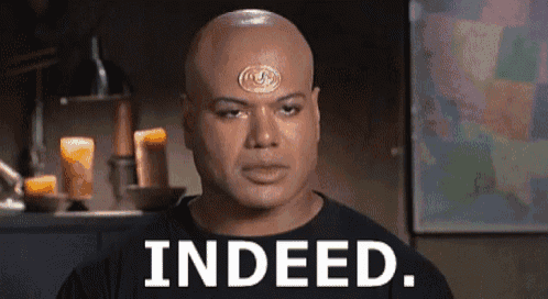 a bald man with a medallion on his forehead says indeed .