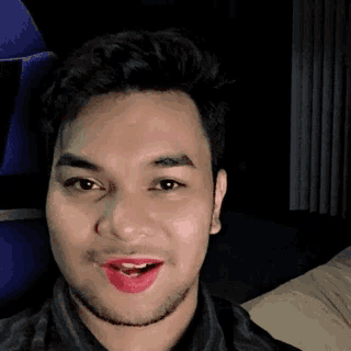 a man with red lipstick on his lips