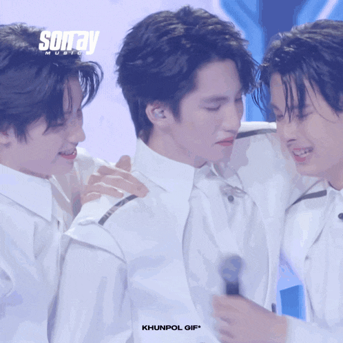 a group of young men are standing next to each other with sonray music written on the top