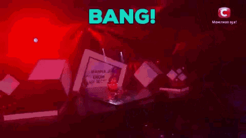 a group of dancers perform on a stage with the words bang in blue
