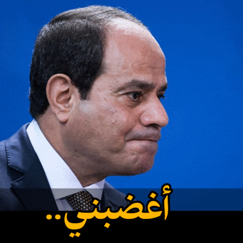 a close up of a man 's face with arabic writing