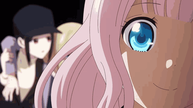 a girl with pink hair and blue eyes is smiling