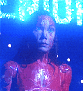 a woman with blood dripping from her face is standing in front of a sign that says ' you '