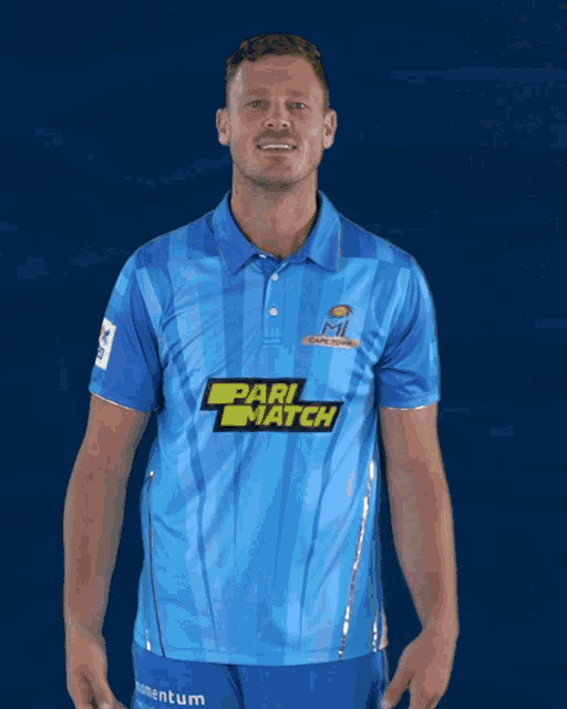 a man in a blue shirt that says pari match