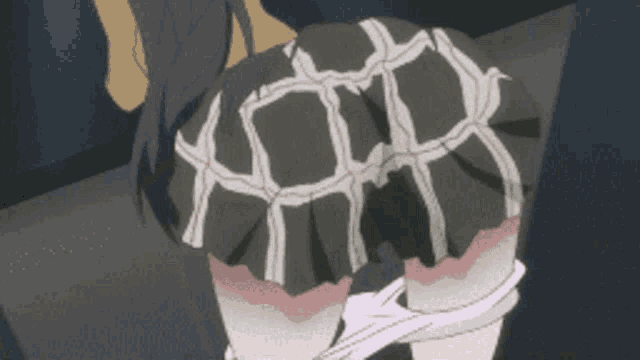 a girl in a plaid skirt is tied up with rope