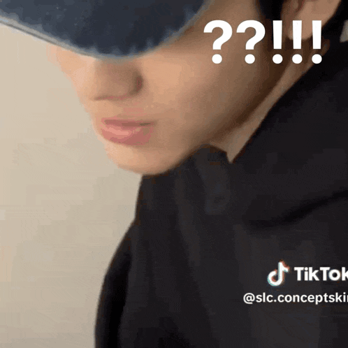 a close up of a person 's face with a question mark above it