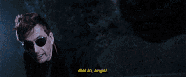 a person in a car with the words get in angel