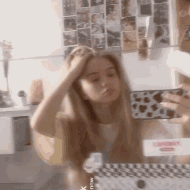 a girl is taking a picture of herself in a mirror