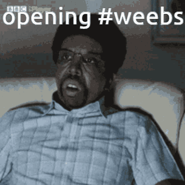 a man in a plaid shirt is sitting on a couch with the words opening #weebs above him
