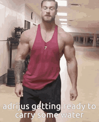 a muscular man in a red tank top with the number 7 on it