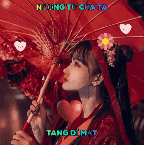 a woman holding a red umbrella with the words tang di mat written on the bottom