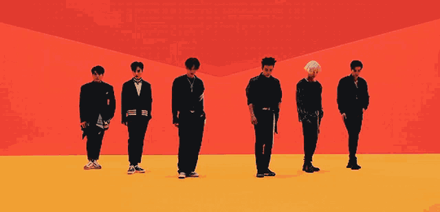 a group of young men are standing in a row on a yellow and orange background