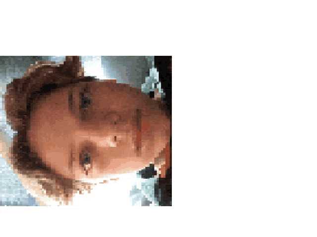a close up of a person 's face with a blurred background