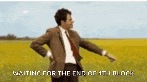 a man in a suit and tie is dancing in a field while waiting for the end of the 4th block .