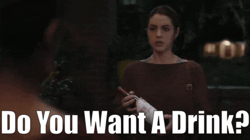 a woman holding a bottle of wine with the words do you want a drink below her