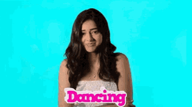 a woman is dancing with her arms outstretched in front of a blue background with the word dancing on it .