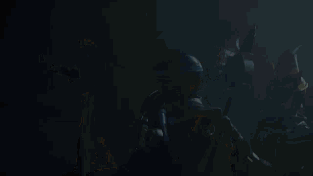 a group of soldiers are standing on a street at night