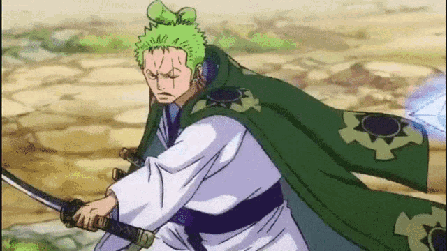 a man in a green cape is holding a sword in his hand .