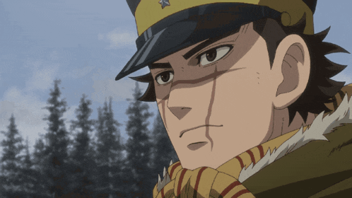a close up of a man 's face with a hat on