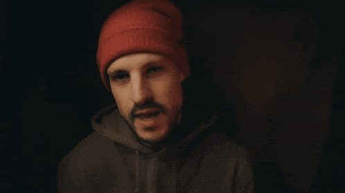 a man in a red beanie says it really doesn 't take a lot to make me happy
