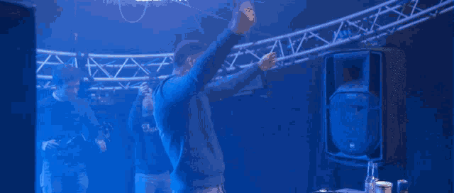 a man dancing in front of a speaker that says rcf on it