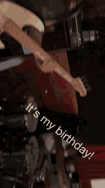 a woman playing a guitar with the words " it 's my birthday " written on the bottom