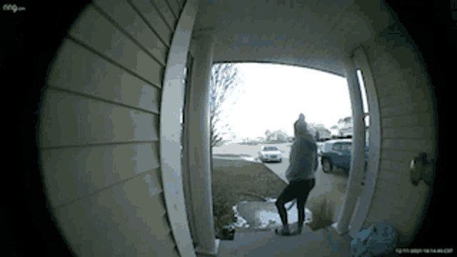 a person standing in front of a door that says ring
