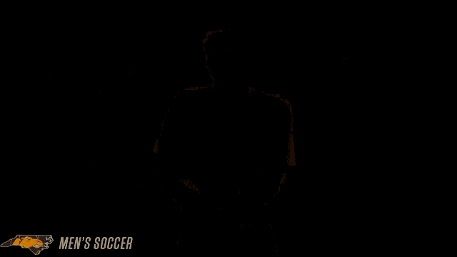 a man in an orange and white jersey with the number 9