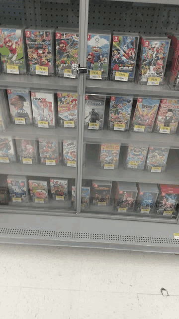 a shelf full of nintendo switch games including super mario